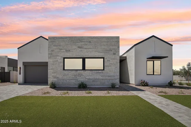 a front view of a house with yard