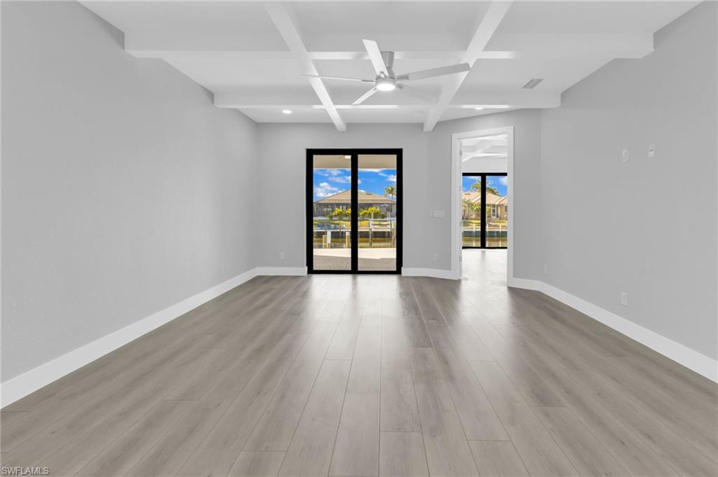 1323 Wesley Drive Punta Gorda, FL 33950 - Photo 13 of 50 wooden floor in an empty room with a window