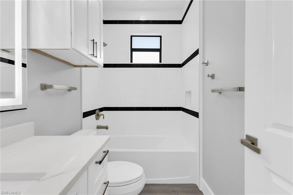 1323 Wesley Drive Punta Gorda, FL 33950 - Photo 20 of 50 a bathroom with a sink a toilet and a bathtub