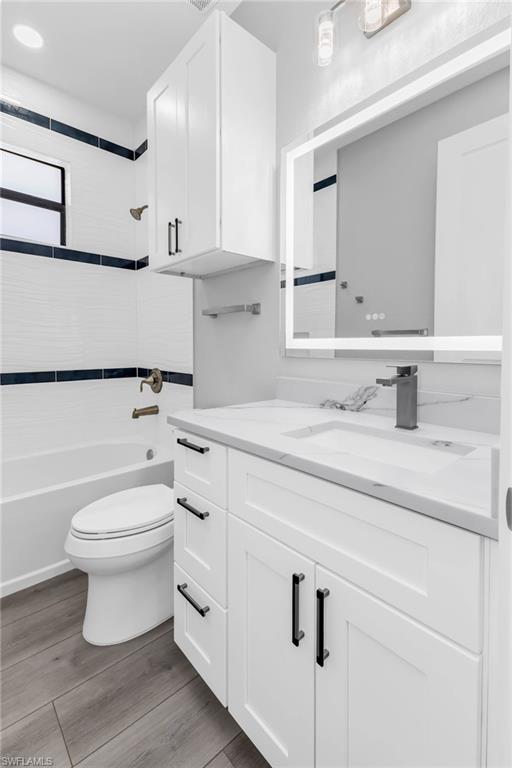 1323 Wesley Drive Punta Gorda, FL 33950 - Photo 24 of 50 a bathroom with a toilet sink and mirror