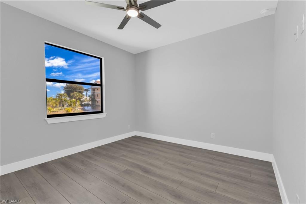 1323 Wesley Drive Punta Gorda, FL 33950 - Photo 25 of 50 a view of empty room with wooden floor