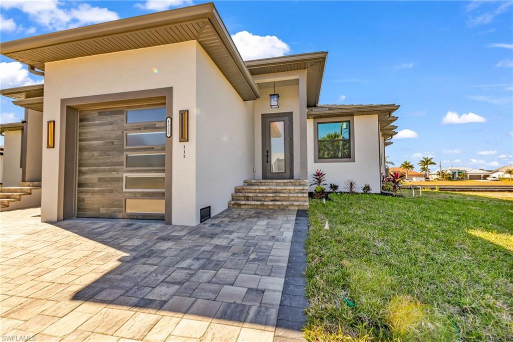 1323 Wesley Drive Punta Gorda, FL 33950 - Photo 3 of 50 a front view of a house with garden