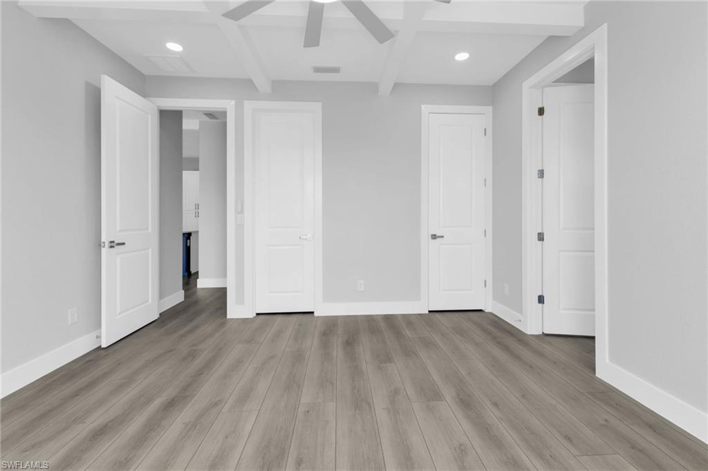 1323 Wesley Drive Punta Gorda, FL 33950 - Photo 36 of 50 a view of an empty room with wooden floor