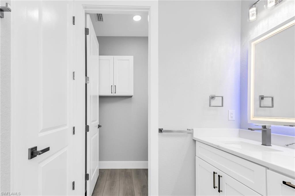 1323 Wesley Drive Punta Gorda, FL 33950 - Photo 40 of 50 a bathroom with a granite countertop sink