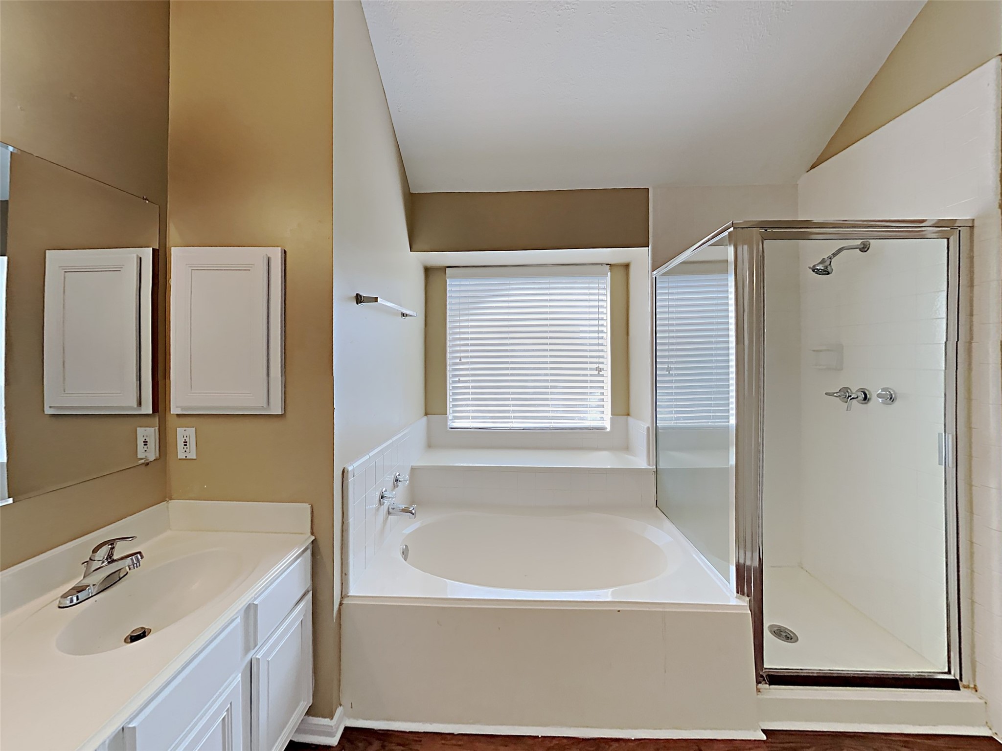 7203 Glen Rosa Drive Katy, TX 77494 - Photo 11 of 22 a bathroom with a tub a sink and mirror