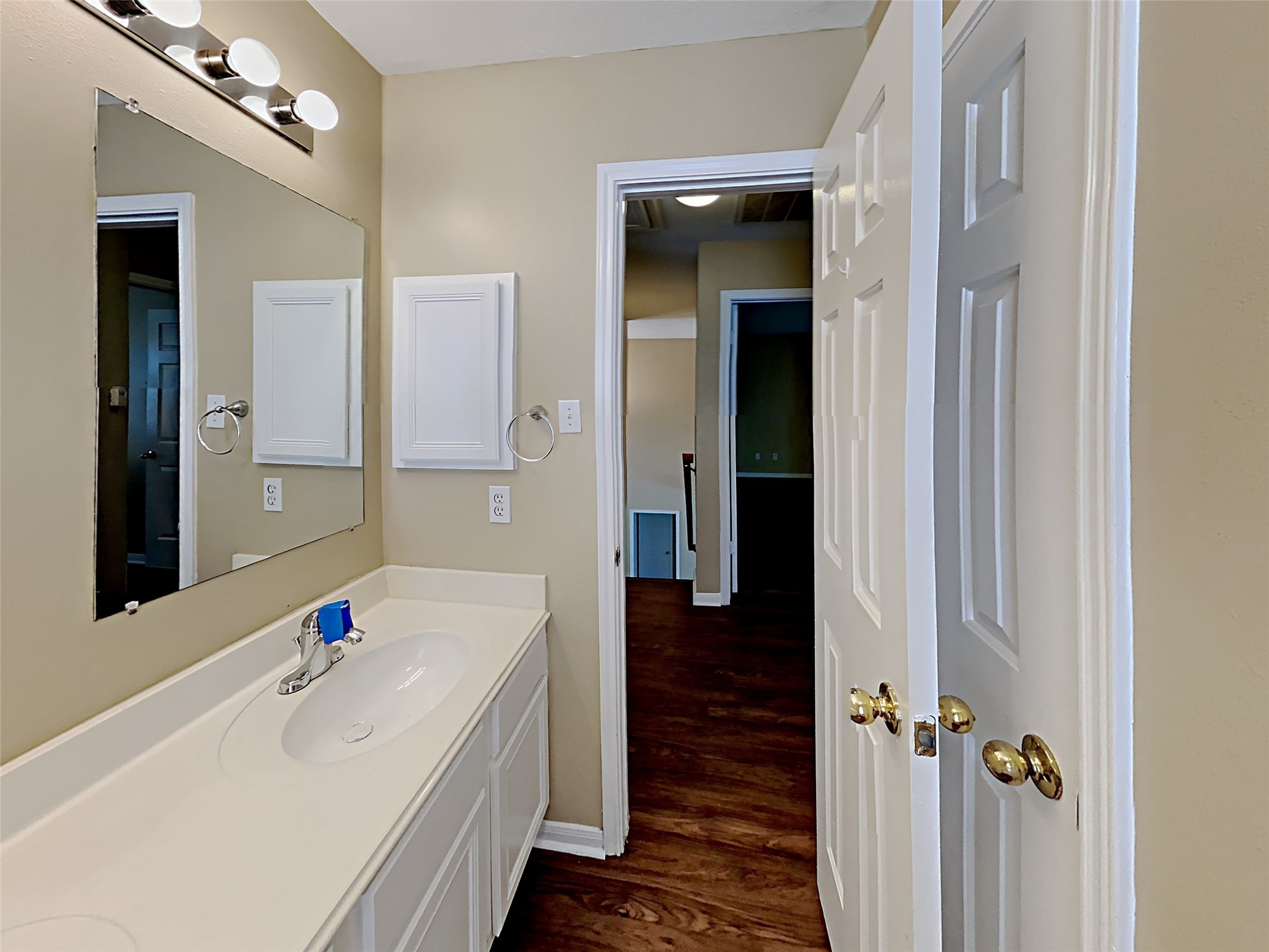7203 Glen Rosa Drive Katy, TX 77494 - Photo 14 of 22 a bathroom with a tub a sink and a large mirror