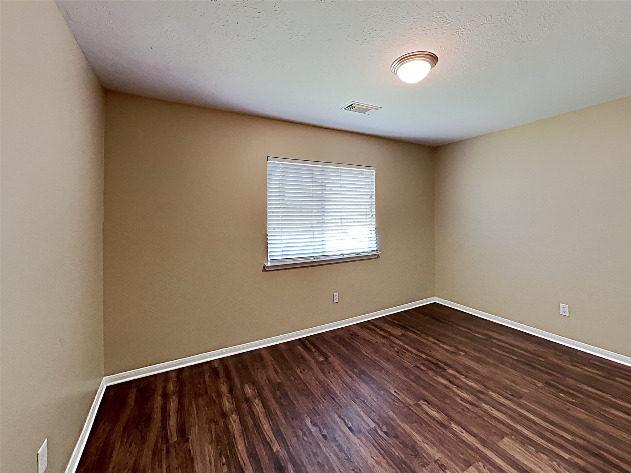7203 Glen Rosa Drive Katy, TX 77494 - Photo 17 of 22 a view of empty room with wooden floor