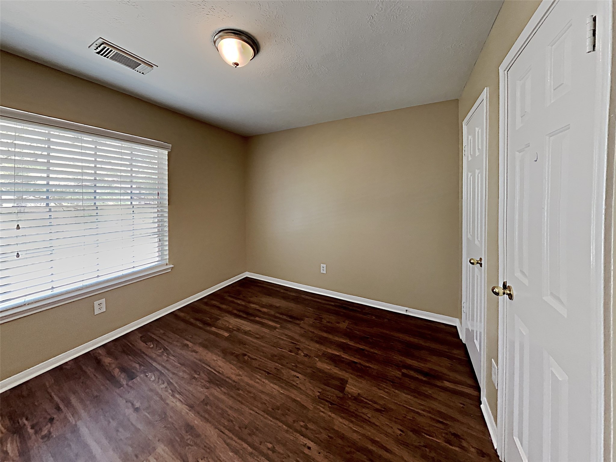 7203 Glen Rosa Drive Katy, TX 77494 - Photo 20 of 22 a view of a room with wooden floor and window