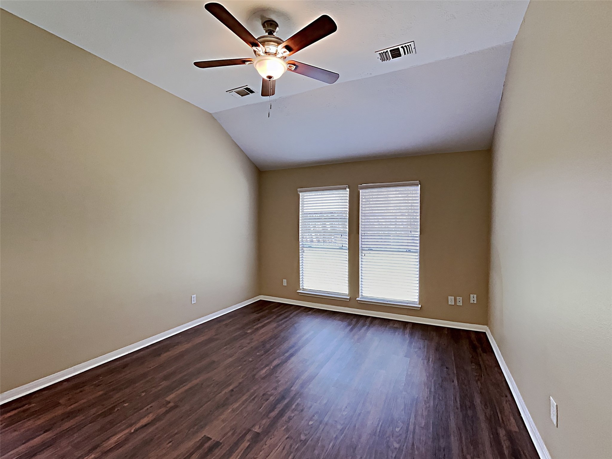 7203 Glen Rosa Drive Katy, TX 77494 - Photo 9 of 22 an empty room with wooden floor and windows