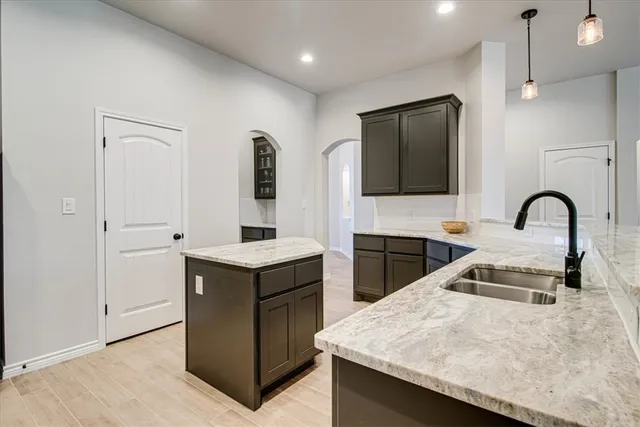 a kitchen with a stove and a kitchen island