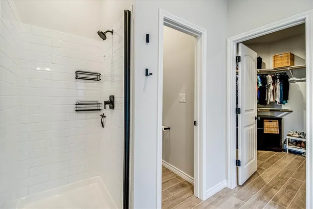 a view of a bathroom from a hallway