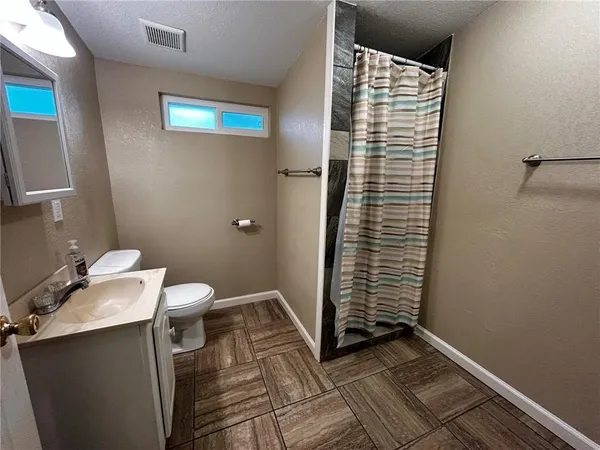 a bathroom with a sink and a toilet