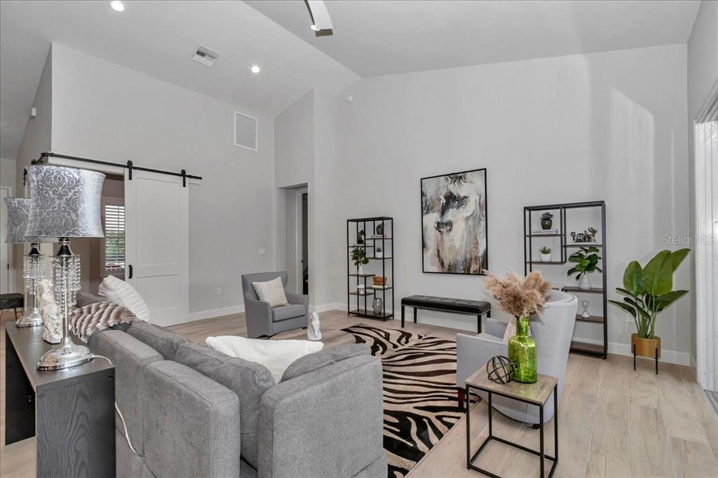 1631 West Highway 329 Citra, FL 32113 - Photo 23 of 82 a living room with furniture and wooden floor