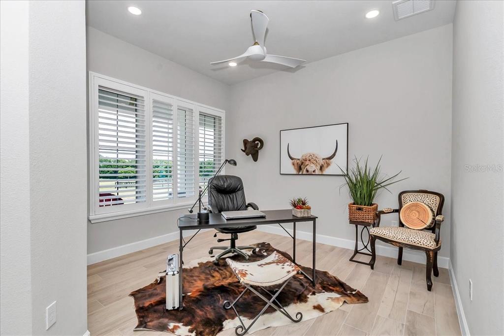 1631 West Highway 329 Citra, FL 32113 - Photo 26 of 82 a work room with furniture and a potted plant