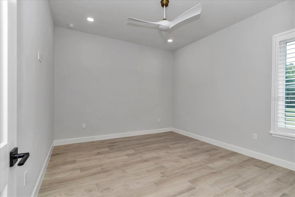 1631 West Highway 329 Citra, FL 32113 - Photo 37 of 82 an empty room with a empty space and a window