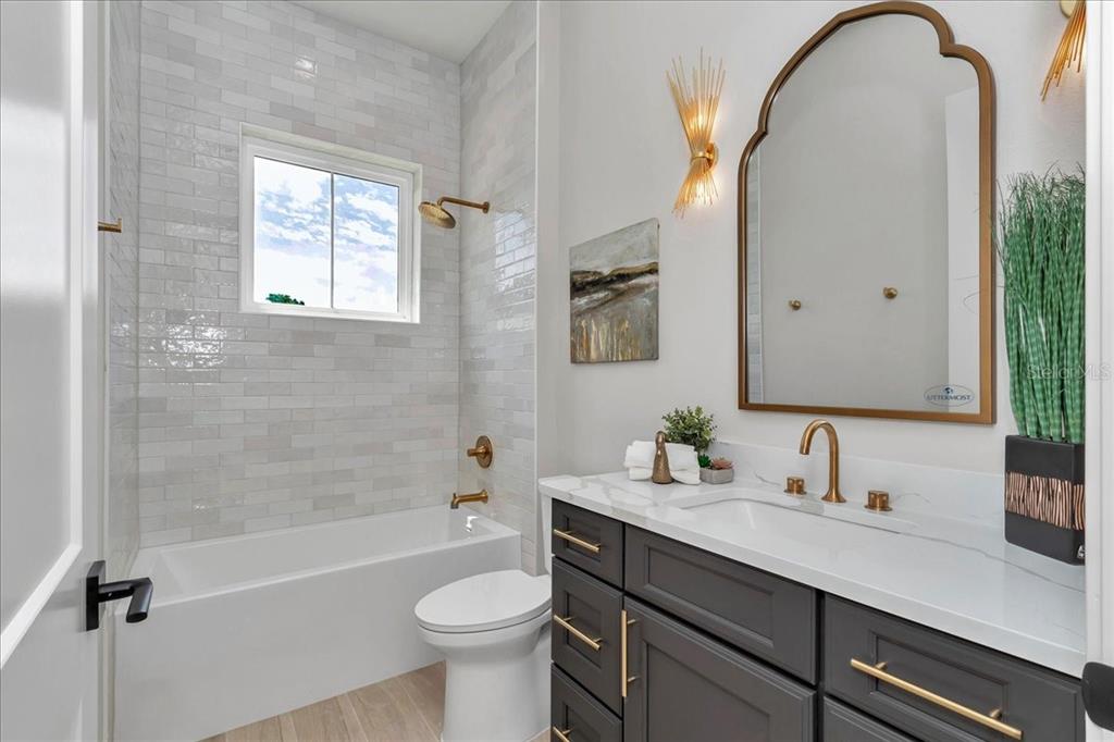 1631 West Highway 329 Citra, FL 32113 - Photo 38 of 82 a bathroom with a sink a toilet and a mirror