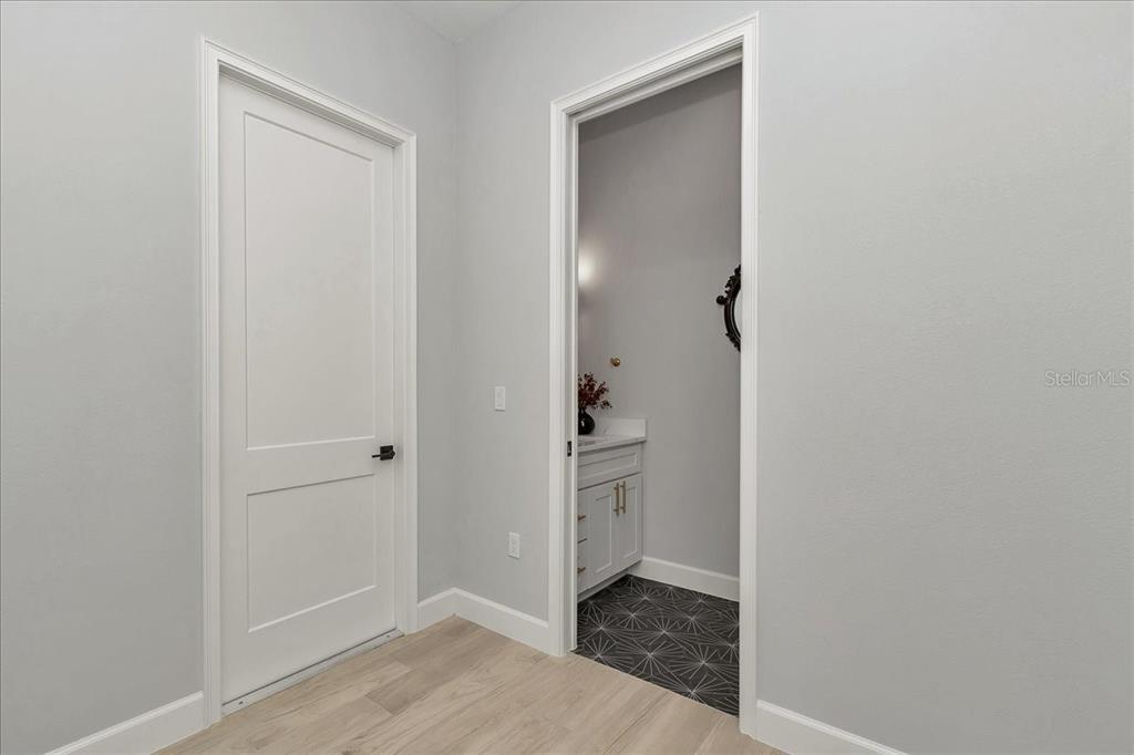 1631 West Highway 329 Citra, FL 32113 - Photo 39 of 82 an empty room with an entrance to other room