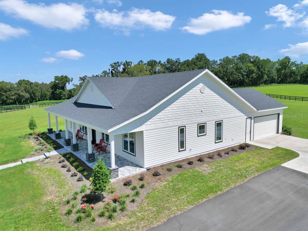 1631 West Highway 329 Citra, FL 32113 - Photo 4 of 82 a view of a house with backyard and garden