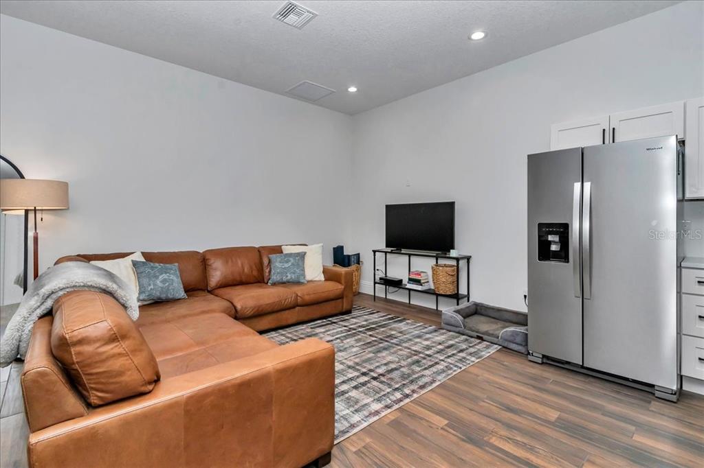 1631 West Highway 329 Citra, FL 32113 - Photo 57 of 82 a living room with furniture and a flat screen tv