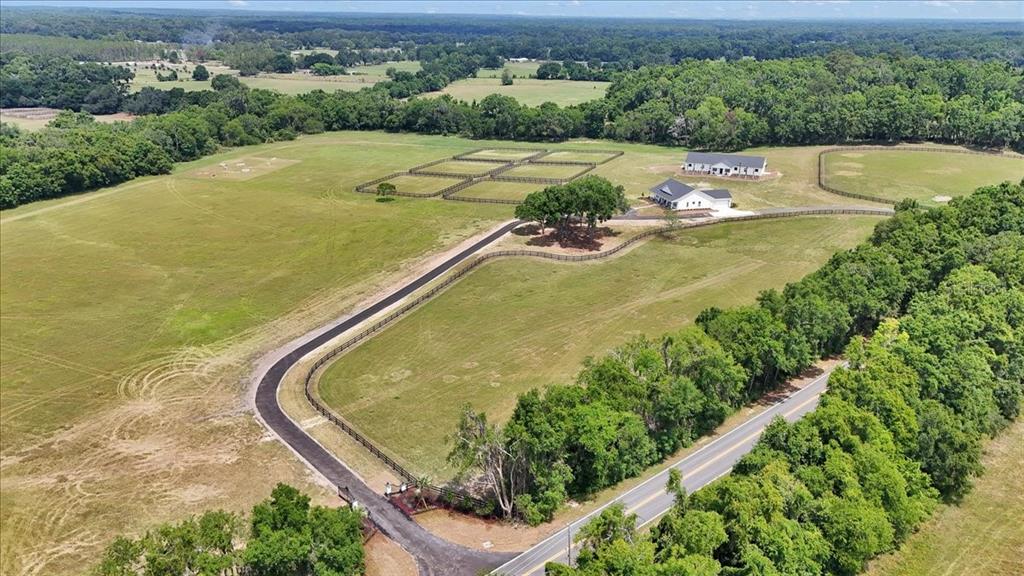 1631 West Highway 329 Citra, FL 32113 - Photo 75 of 82 an aerial view of a house with a yard