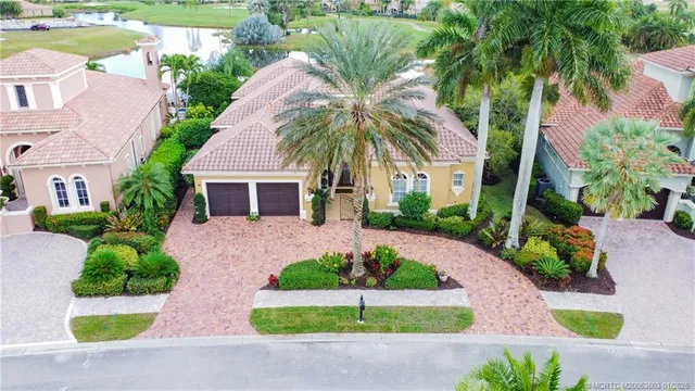 an aerial view of residential house with outdoor space and swimming pool