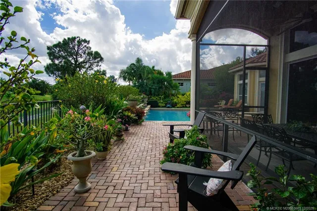 a view of a two chairs and table in the balcony
