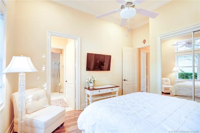 a living room with furniture a fireplace and a chandelier