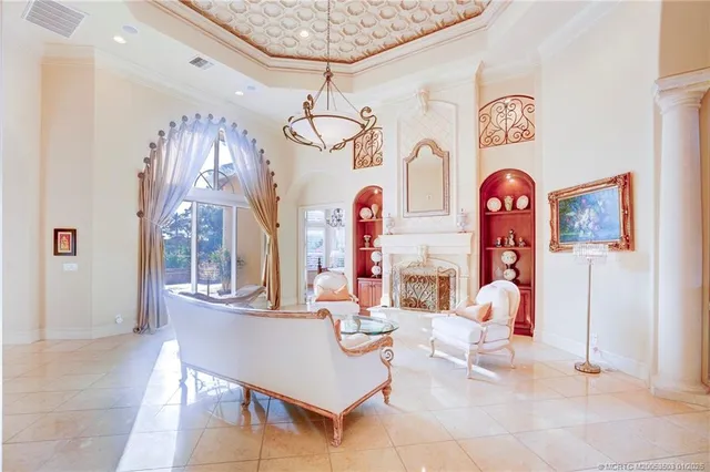 a bedroom with bed tv and window