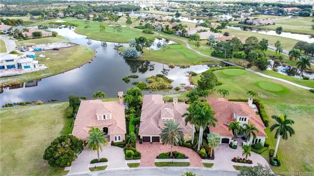 an aerial view of residential house with outdoor space and swimming pool