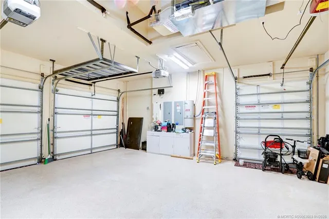 a view of a dining room with furniture chandelier and a chandelier