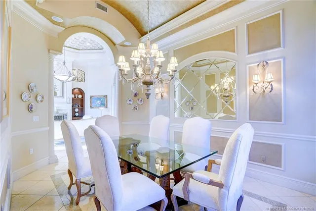 a living room with lots of furniture and a large window