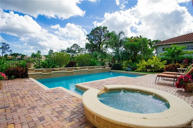 a view of a two chairs and table in the balcony