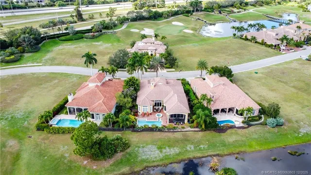 an aerial view of house with yard swimming pool and outdoor seating