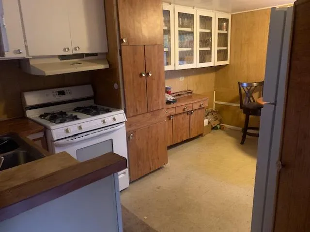 a kitchen with a stove and a cabinet