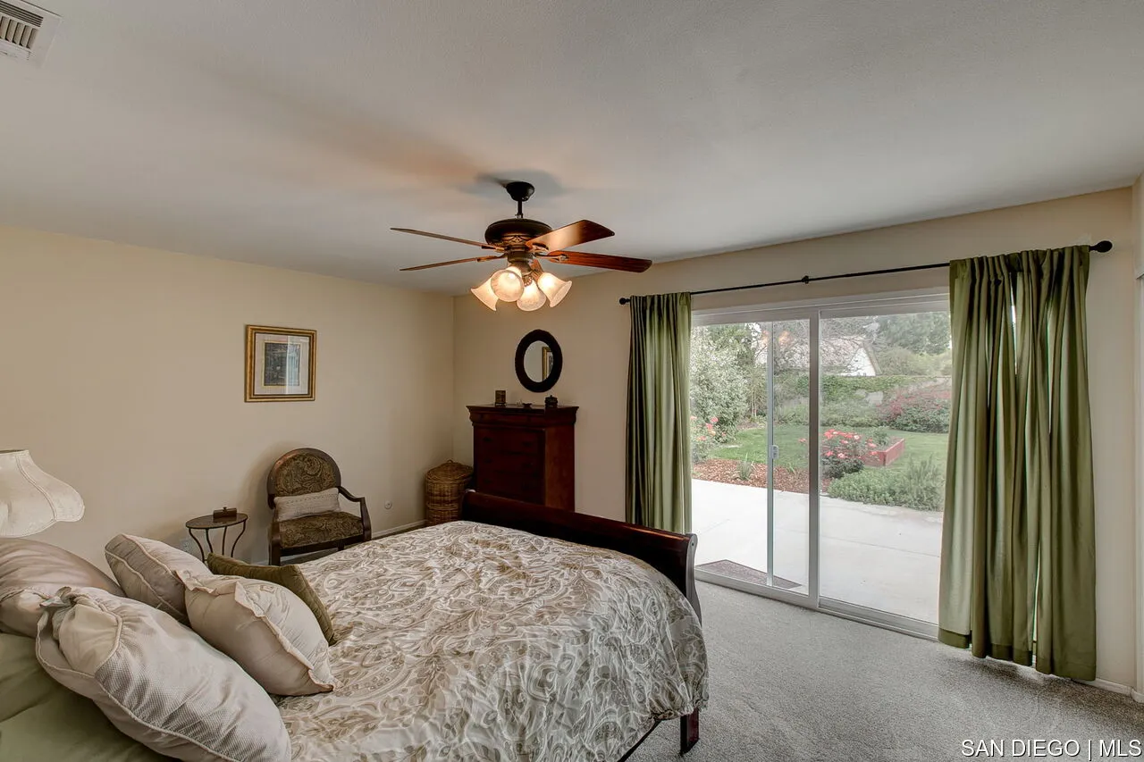 4700 Circle Lazy J Road Riverside, CA 92501 - Photo 13 of 24 a bedroom with a bed and a large window