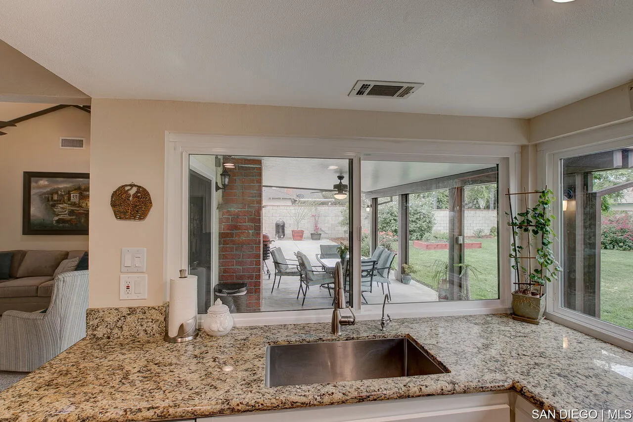 4700 Circle Lazy J Road Riverside, CA 92501 - Photo 5 of 24 a view of a livingroom with furniture and floor to ceiling window
