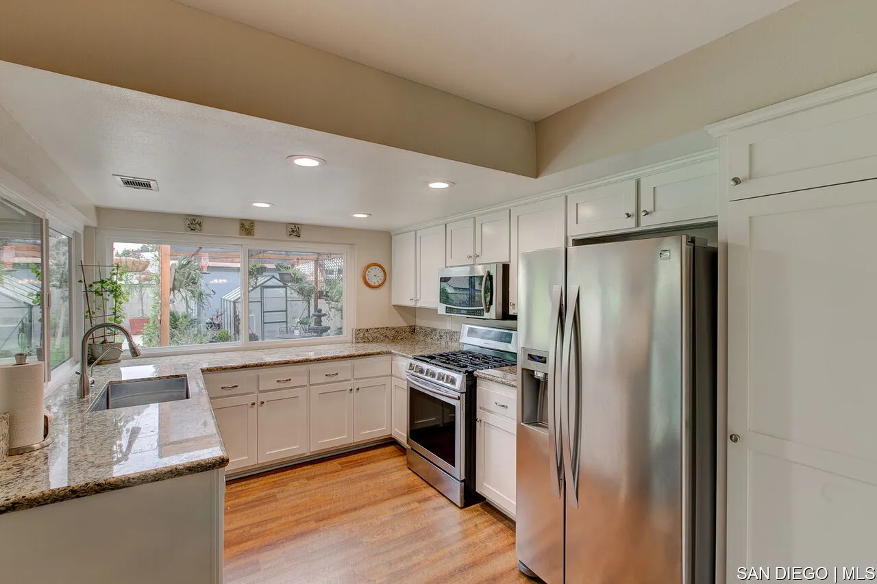 4700 Circle Lazy J Road Riverside, CA 92501 - Photo 6 of 24 a kitchen with stainless steel appliances granite countertop a refrigerator and a sink