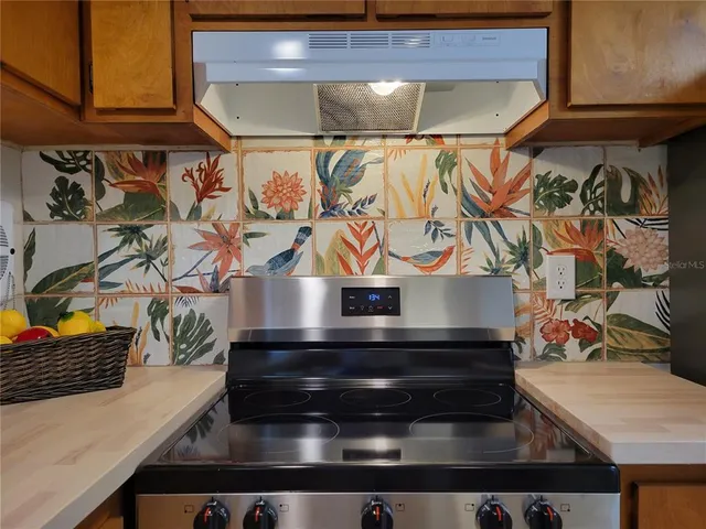 a view of a kitchen with a refrigerator