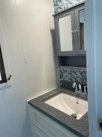 a view of a livingroom with a dishwasher and a window