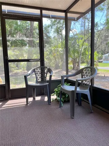a view of an empty room with a large window