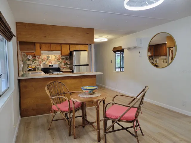 a dining room with furniture and window