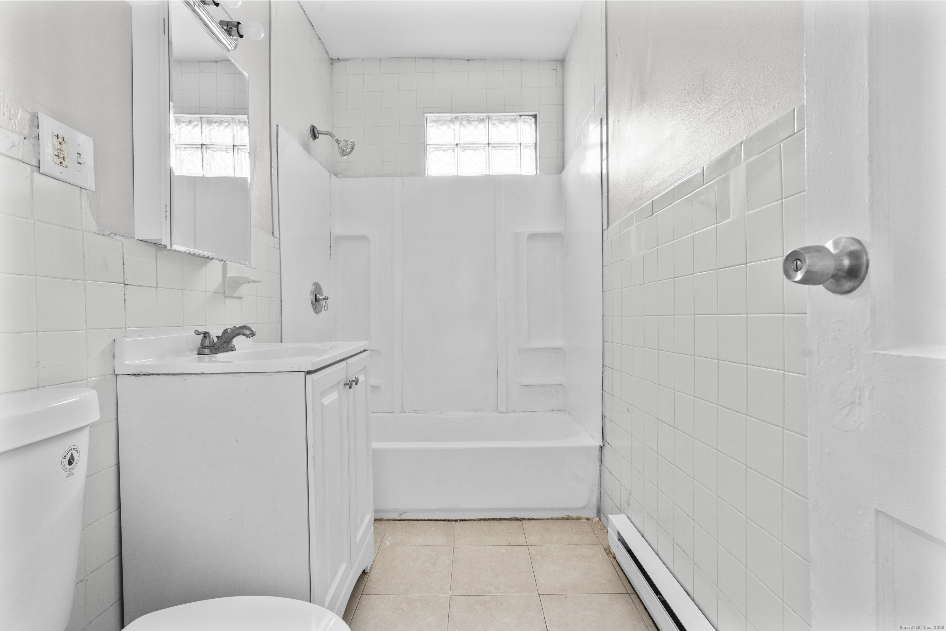 141 Draher Street Waterbury, CT 06708 - Photo 13 of 20 a bathroom with a bathtub a sink a toilet and a shower