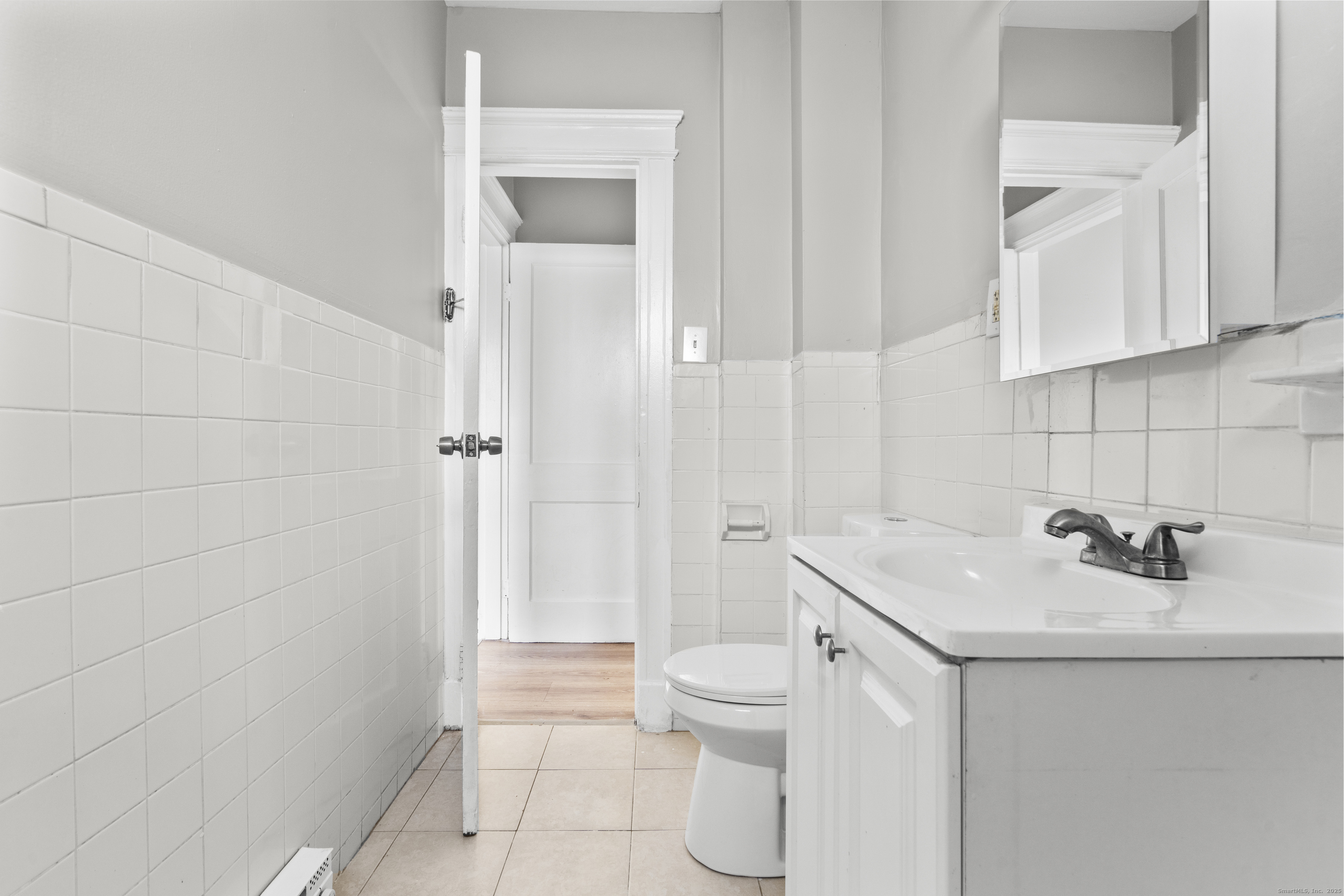 141 Draher Street Waterbury, CT 06708 - Photo 14 of 20 a bathroom with a sink toilet and shower