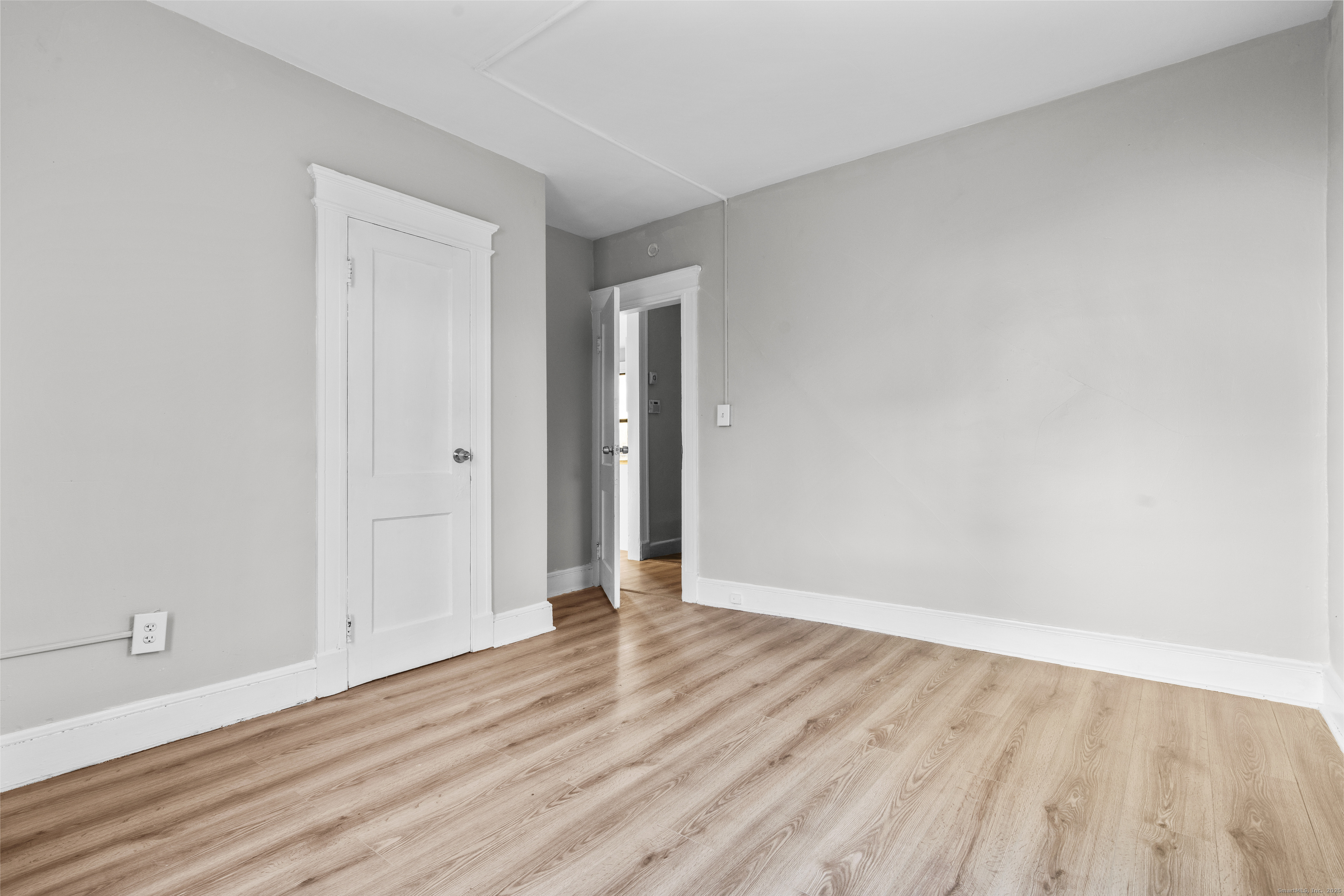 141 Draher Street Waterbury, CT 06708 - Photo 18 of 20 a view of an empty room with wooden floor