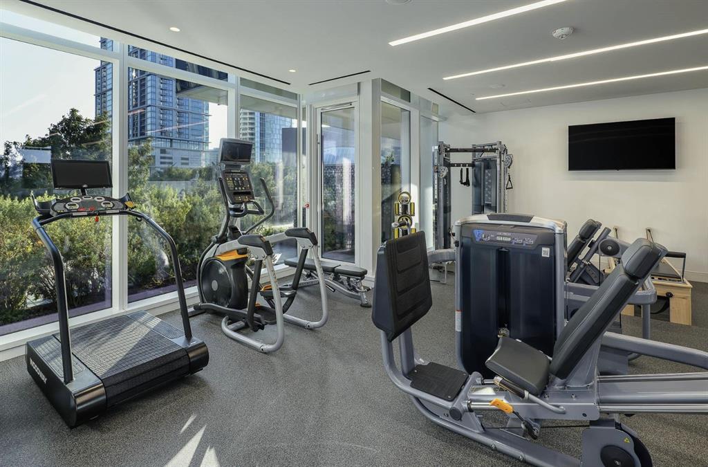 1747 Leonard Street, Unit 1402 Dallas, TX 75201 - Photo 29 of 36 a view of a room with gym equipment