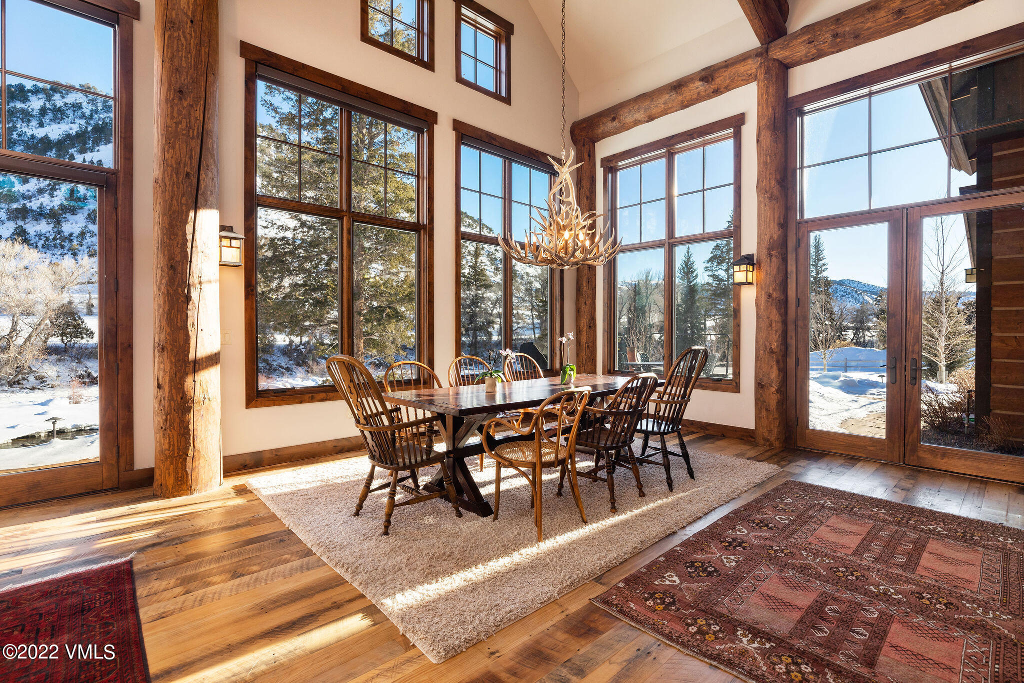 21850 Highway 6 Eagle, CO 81631 - Photo 7 of 27 a view of a dining room and livingroom with furniture wooden floor and a rug