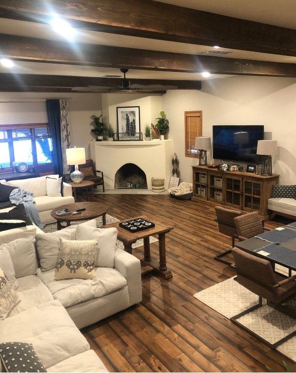 5100 Farm To Market Road 690 Burnet, TX 78611 - Photo 9 of 10 Living area with beamed ceiling, dark wood finished floors, and a fireplace