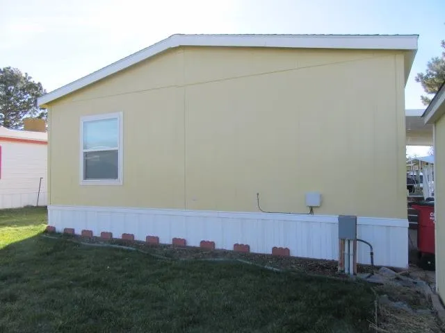 a view of a balcony with chair and wooden floor