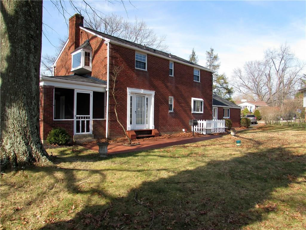 914 Wible Run Road Pittsburgh, PA 15209 - Photo 3 of 25 Side screened in porch and rear brick pario