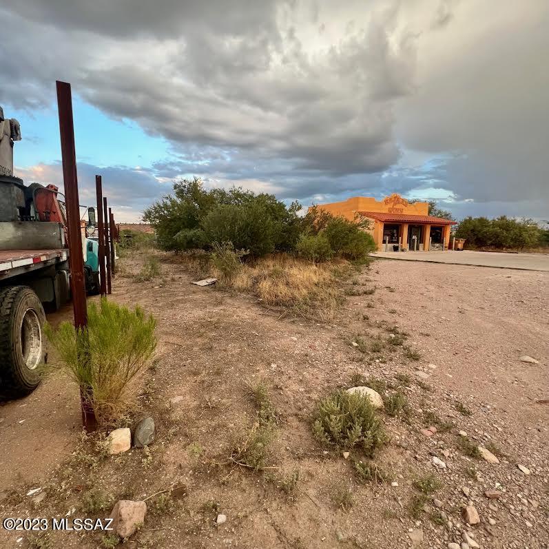 1217 West Frontage Road Rio Rico, AZ 85648 - Photo 2 of 18 a view of a house with a yard fire pit and furniture